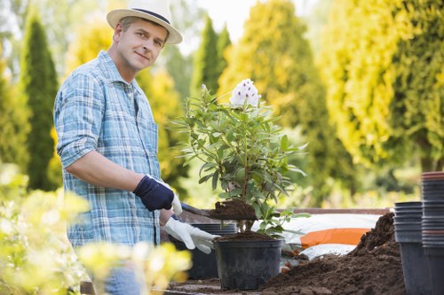 Operative conducting site safety check before garden maintenance
